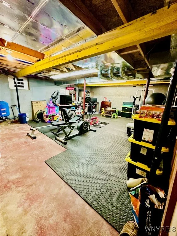 Large basement with high ceilings could easily be fully finished.. currently used for laundry, extra office, play and workout area, and workshop.