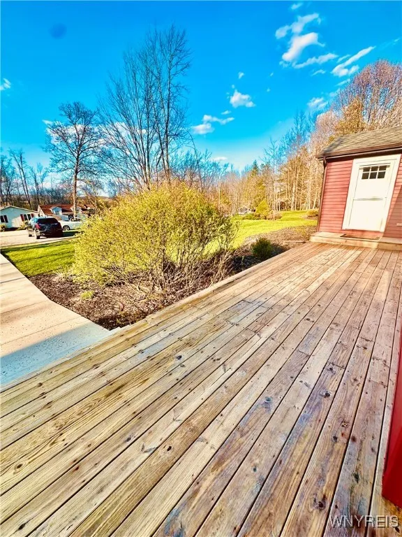 Enjoy the spacious front yard from the open porch. Just a block off the lake.