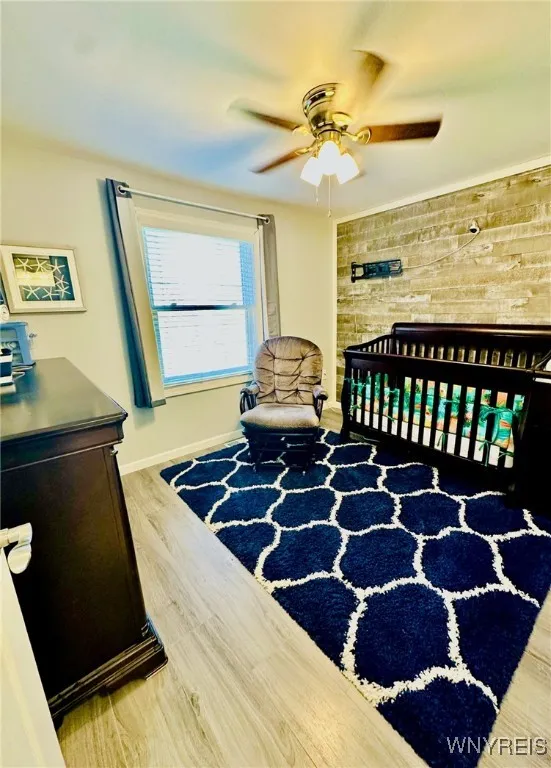 3rd bedroom also has a deep closet, ceiling fan and shiplap wall.