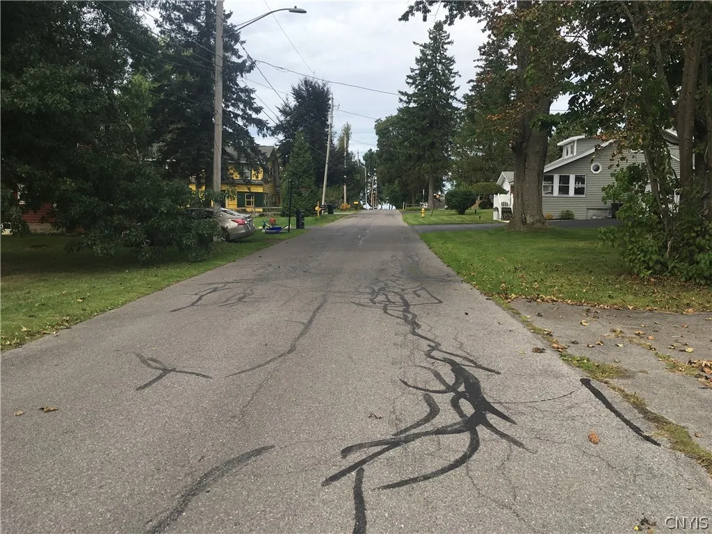 As you stand looking north on the street, there are about five houses to Oneida Lake