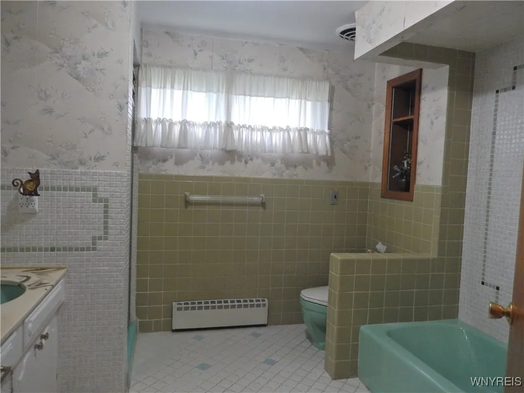 Full Bath on 2nd floor features double sinks, tub and separate stand in shower