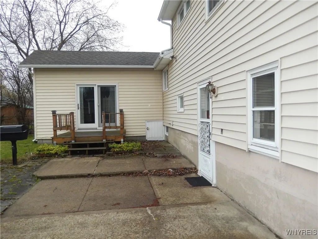 Deck overlooking concrete patio