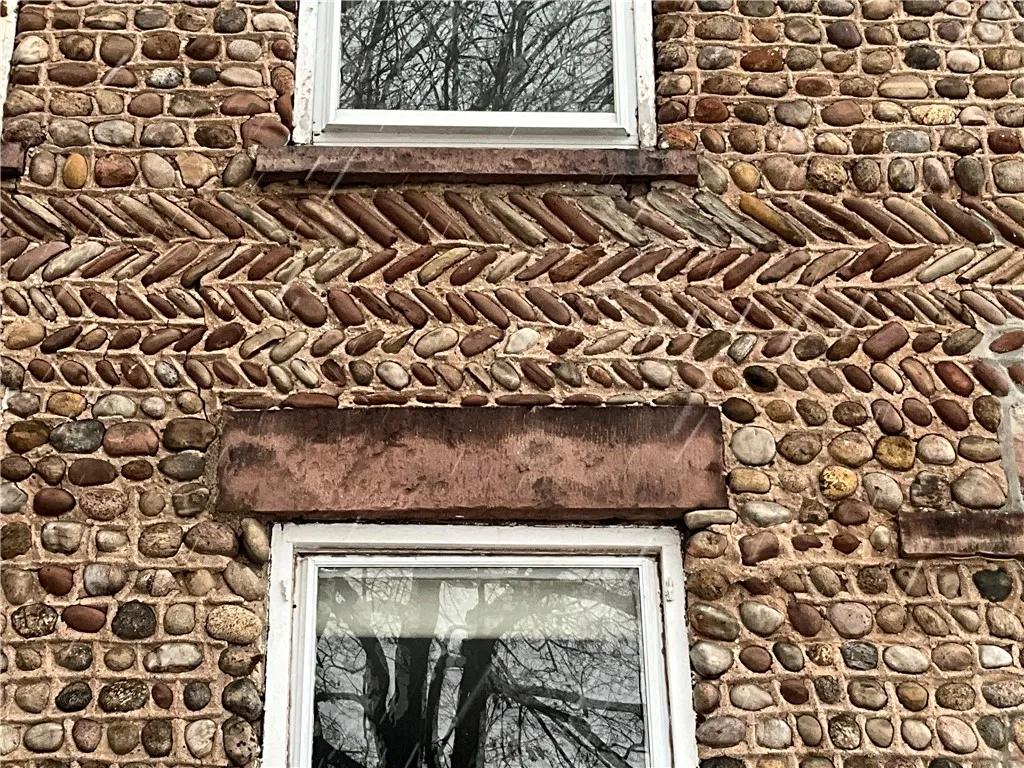 Notice the row of stone laid in herringbone pattern!