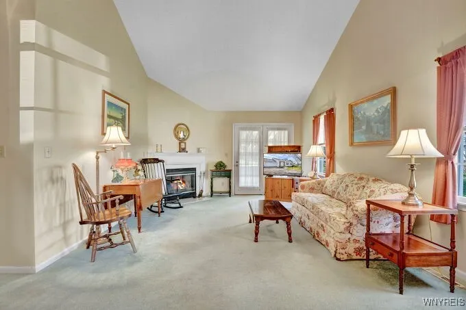 Spacious living room with cathedral ceiling and gas fireplace