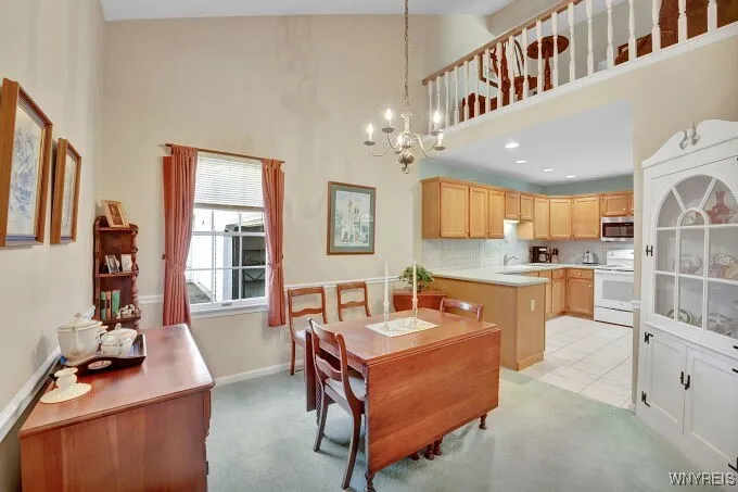 Formal diningroom has cathedral ceiling