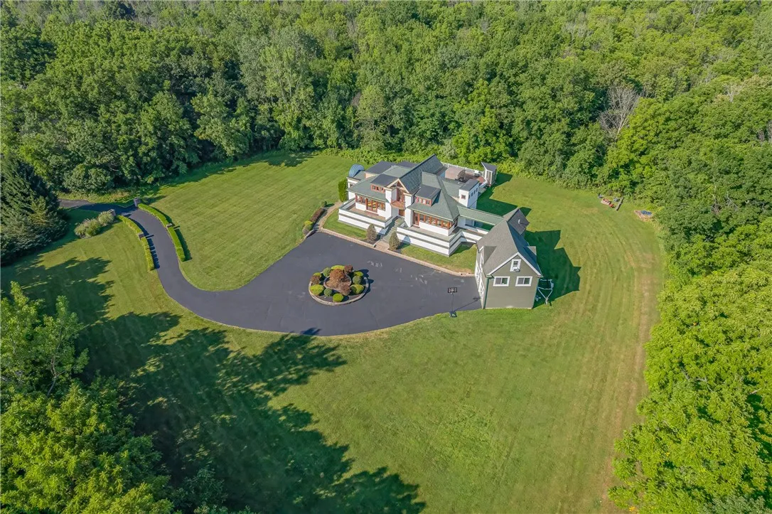 IMPRESSIVE DRIVEWAY ENTRANCE LEADING TO THIS ARCHITECT'S GEM!