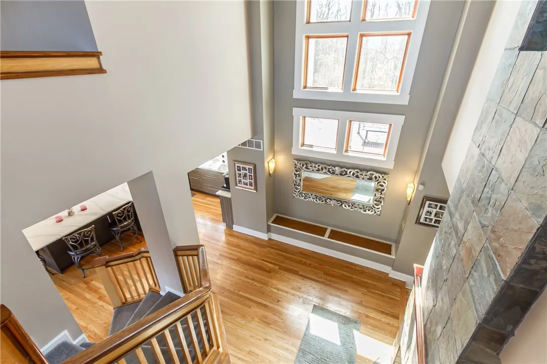 VIEW OF TWO STORY CATHEDRAL CEILING FROM UPSTAIRS LANDING!
