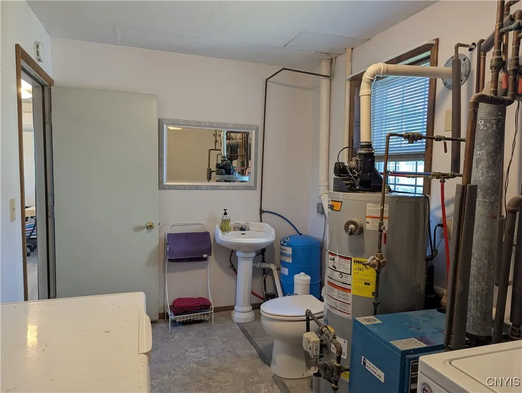 Utility room with half bath