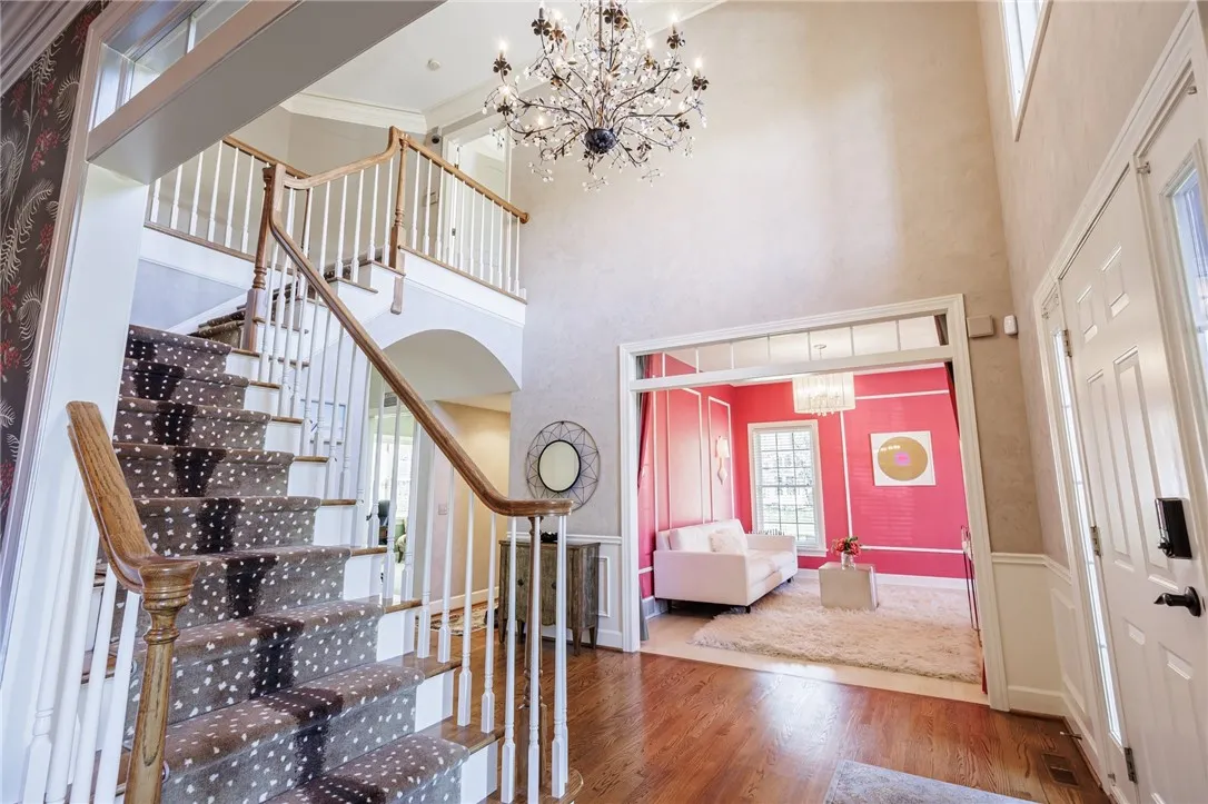 Two story foyer with grand staircase