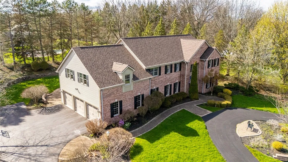 Both circular driveway and side loading driveway
