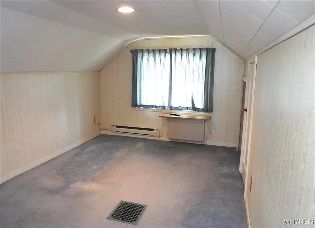 Upper bedroom more spacious than captured