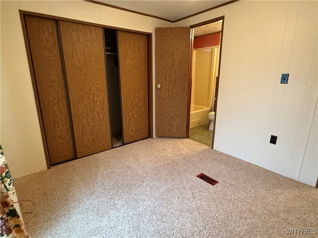 Entrance to bathroom outside second bedroom.