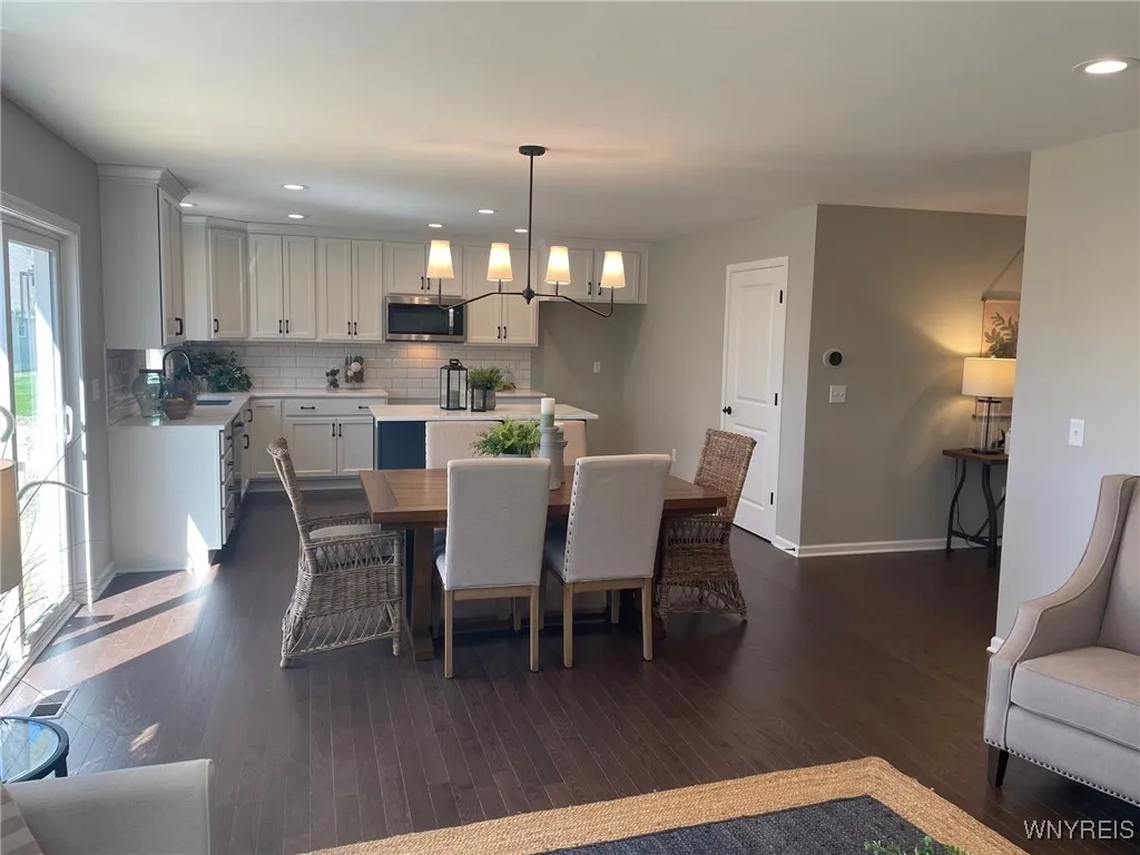 Sliding glass door opens to woods and view of pond with no rear neighbors
