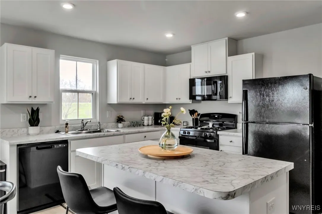 Kitchen island offers a casual eating option as well as more storage and food prep space!