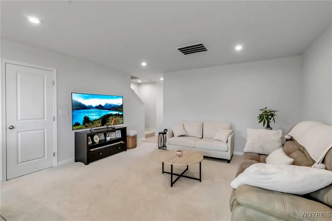 Family room with stairs in background.  That\'s the pantry closet on the left.