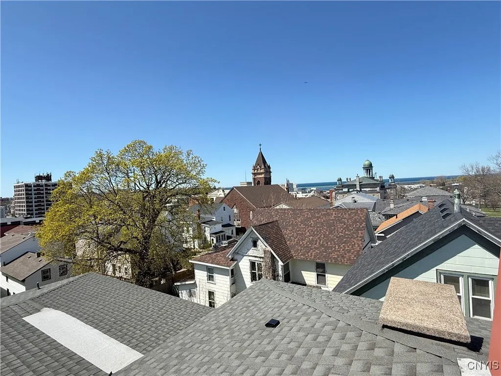 this roof is a shingled design metal roof.  This roof and hatch to get onto the roof from the attic.  Approximately $65k dollars.  You just have to walk up and go out on that roof.