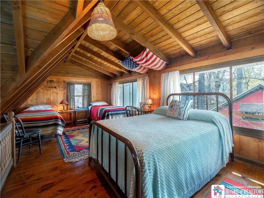 Loft living harkens back to days at summer camp. The back wall features built in screens to allow the fresh air to flow through the cottage.