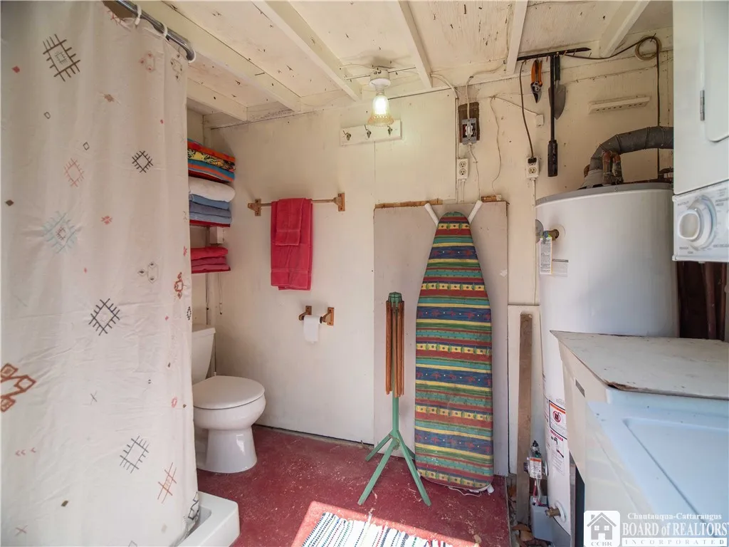 Auxiliary bath services the rear bunkhouse. Laundry and hot water tank housed here. Access to crawl space behind the ironing​​‌​​​​‌​​‌‌​‌‌​​​‌‌​‌​‌​‌​​​‌​​ board.