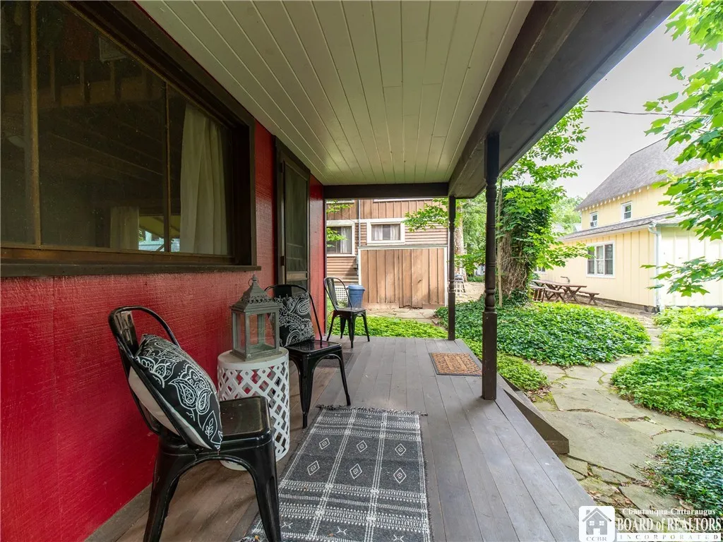 The private porch looks out to the rear yard.