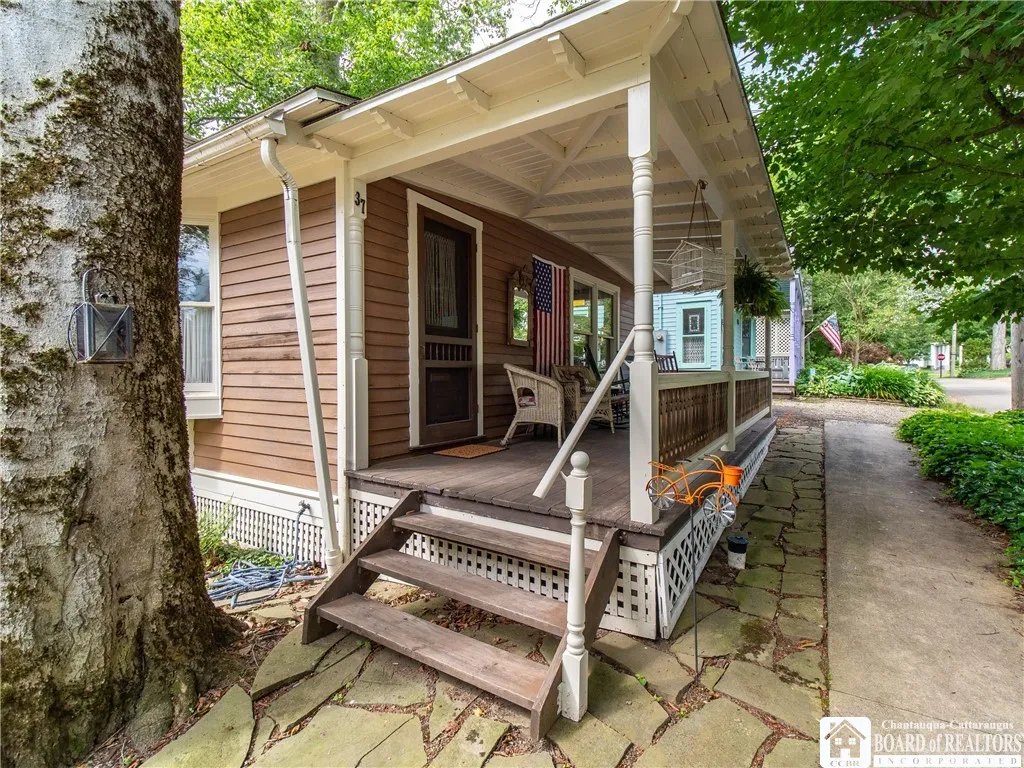 The deep porch overlooks the lovely treelined street.
