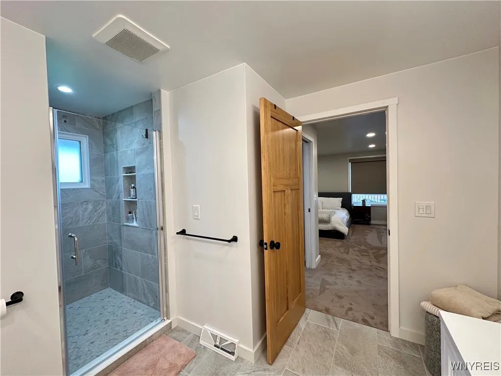 The primary bath is a step away