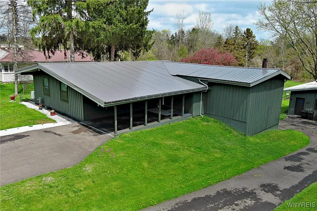 2 driveways- one to the home & carport & one to the 30x50 garage/workshop