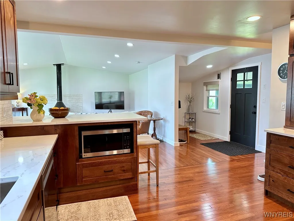 View of the mudroom area & great room from the kitchen