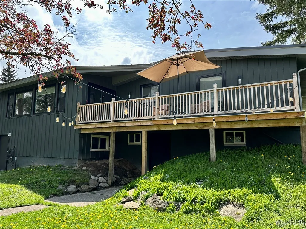 The back of the home has a 2nd story deck & 2 doors that go into the finished lower level.