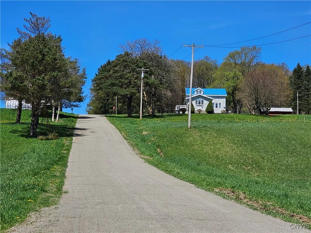 From Hall Road looking up. Gas line between the electric pole and the road.