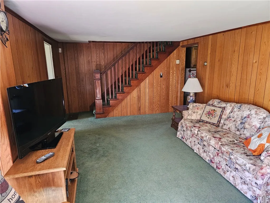 Living room looking east to west. Likely the tv and couch will be left.