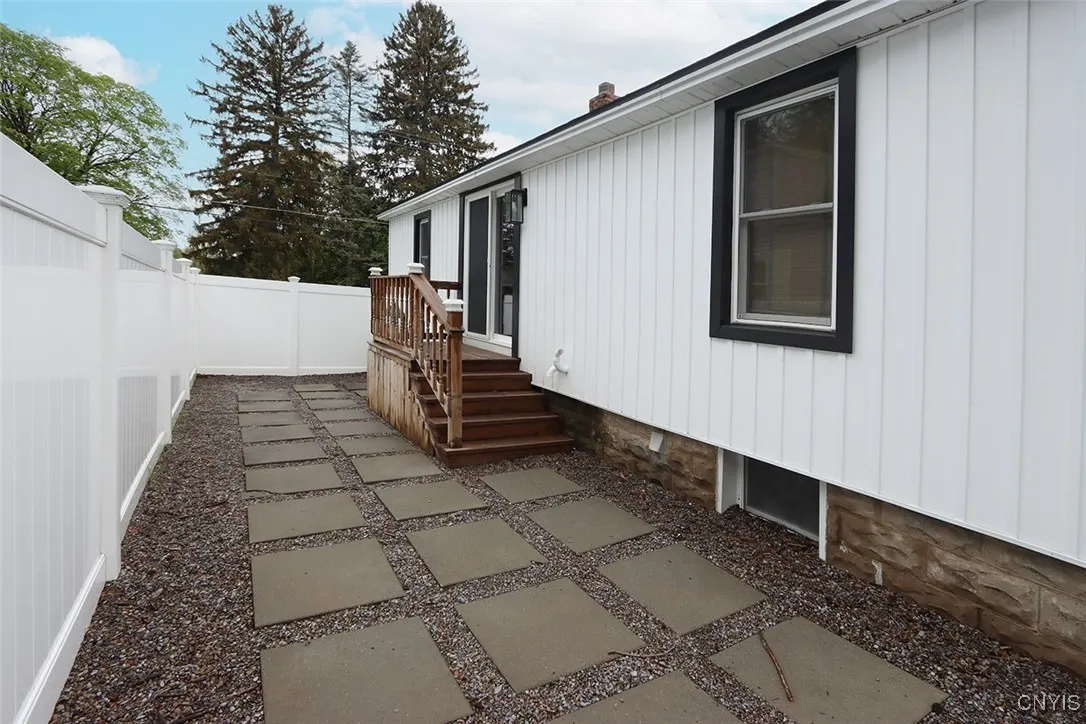 Side porch leading to yard.