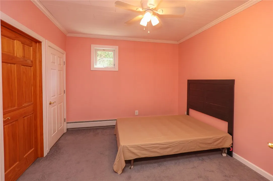 Lower level bedroom with excess to utility room