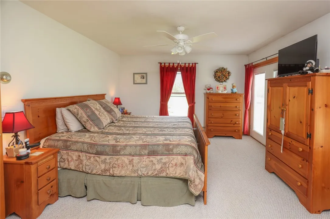 Primary bedroom with sliding glass door to balcony