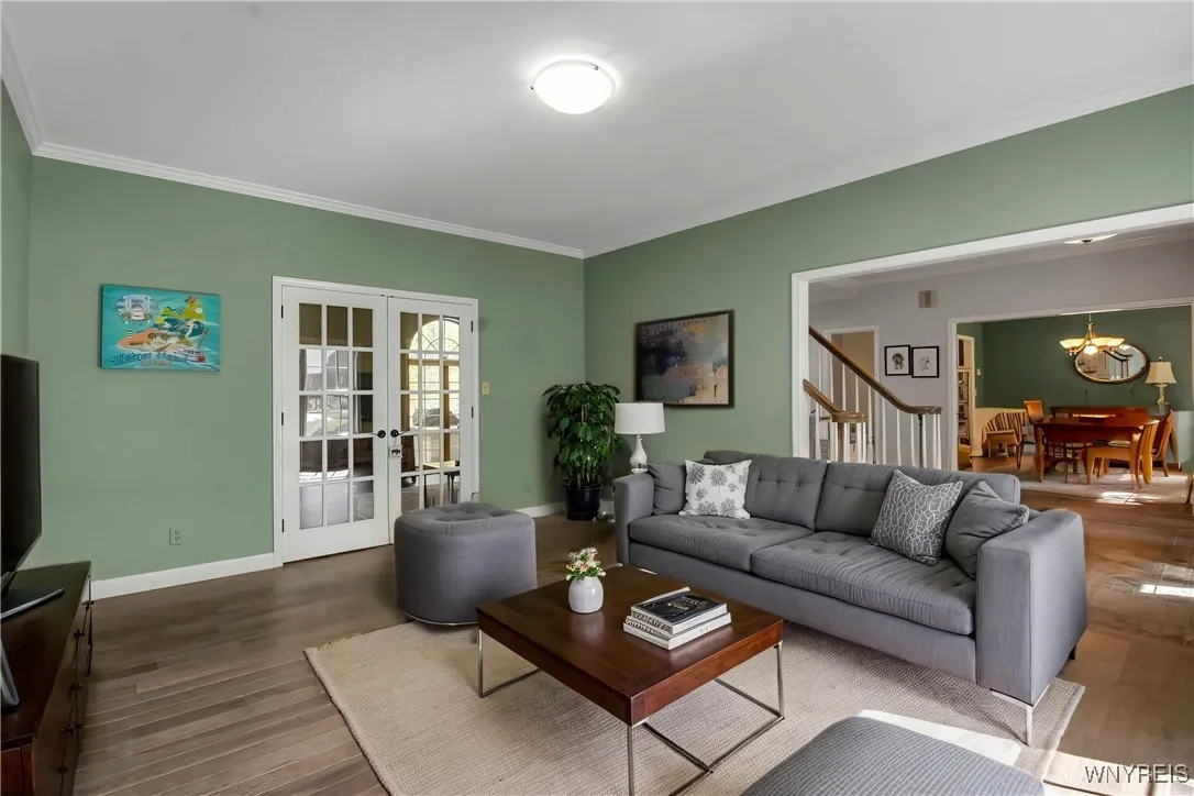 Living Room is vacant and photo is staged with furnishings for visual perspective only