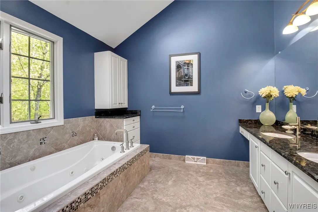 Primary Bedroom Suite with ensuite baths & dual walk-in closets