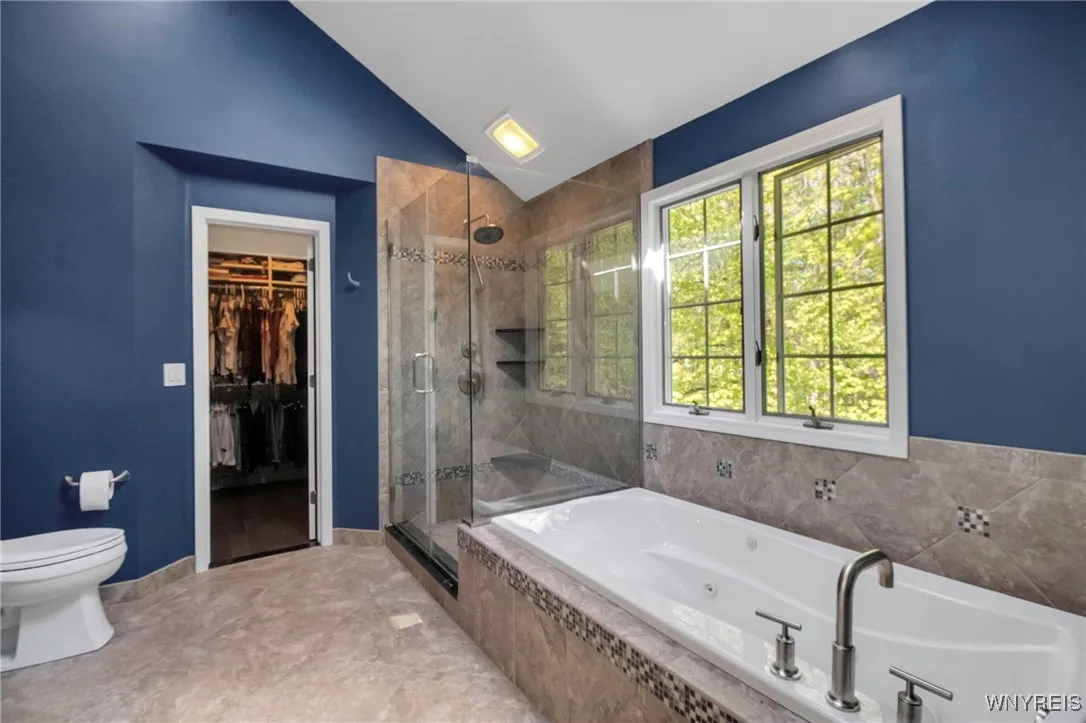 Primary Bedroom Suite with ensuite baths & dual walk-in closets