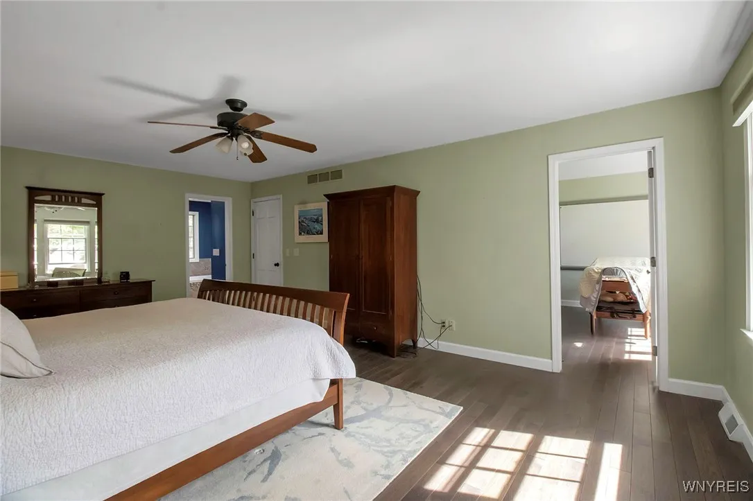 Primary Bedroom Suite with ensuite baths & dual walk-in closets