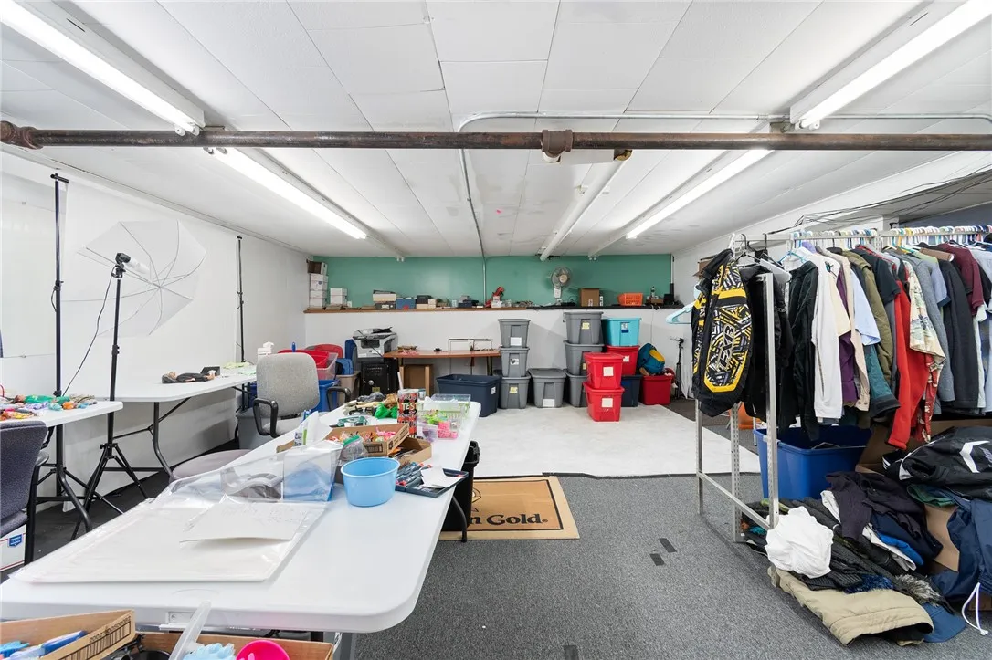 The lower level- clean and dry space for storage- could be used as a photography studio- retail space- climate controlled storage and SO MUCH MORE!