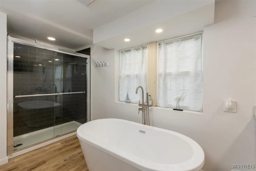 with soaking tub and shower