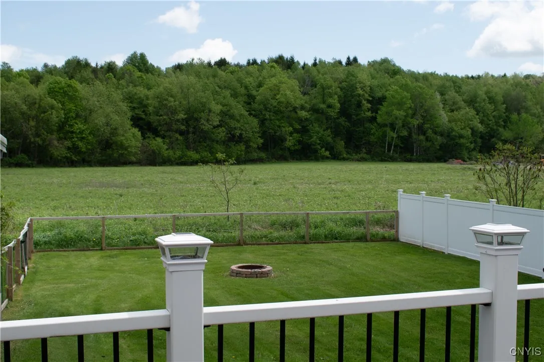 Fenced in portion of back yard from deck.