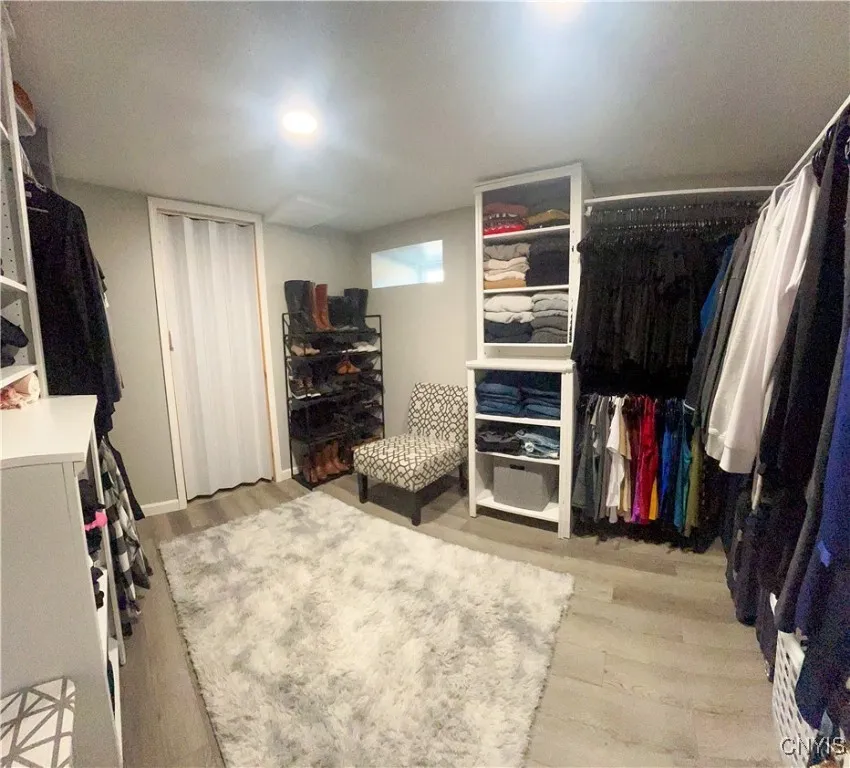 Walk in closet for primary bedroom.