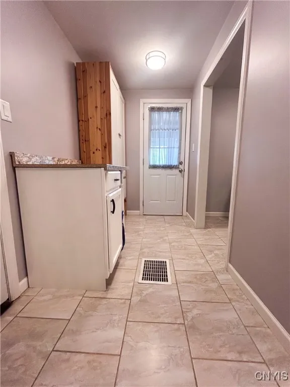 Entrance from garage on left.  Laundry to the right.