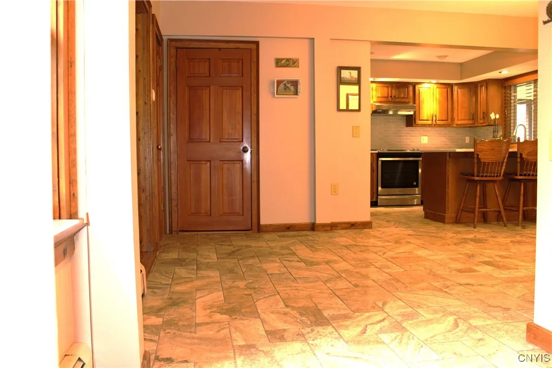 view from front entryway to dining and kitchen