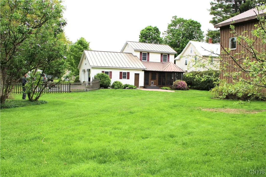 backyard view of home and barn