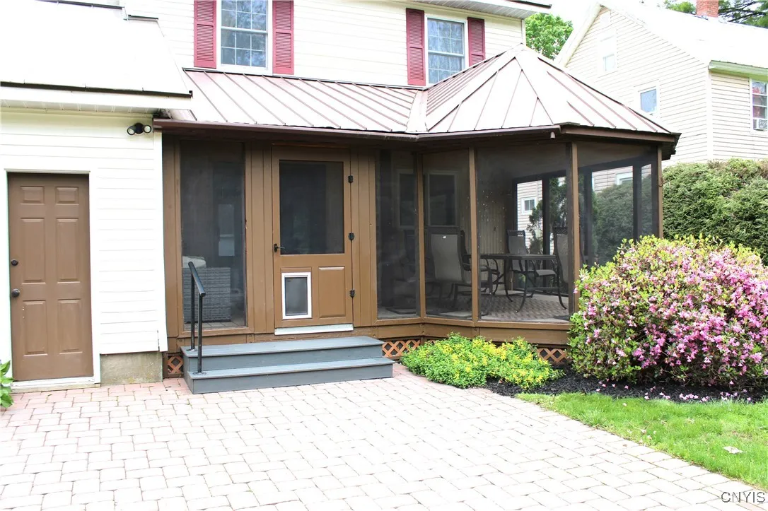 outside view of porch, patio and side garage door