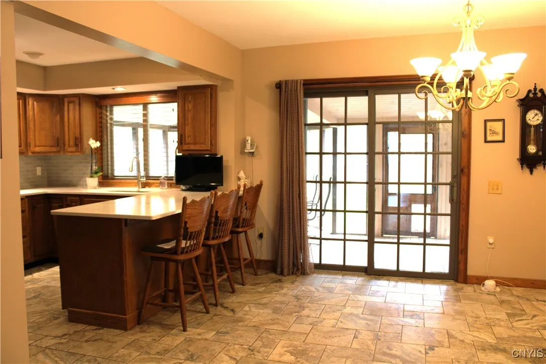 Breakfast bar and sliding glass doors to screen porch