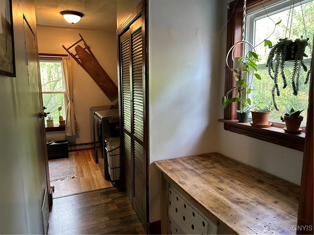 Hall to first floor laundry and basement access