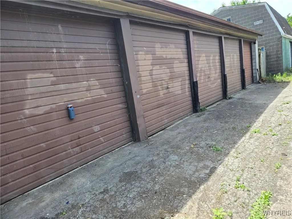 The 5 separate doors you will enter.  The first 3 are connected inside, and the last 2 garages are separated from the other 3 by a wall.