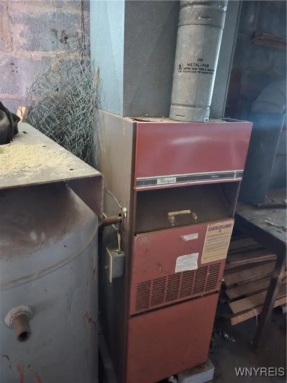 There is a heater purchased by the current owner.  Seller thinks it is electric, but electric in the garages is currently shut off.
