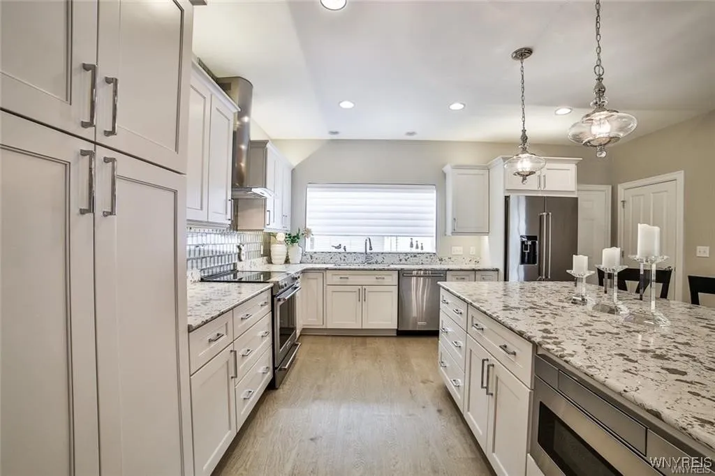 Kitchen showing Pantry Cabinetry, Built-in Microwave, Enlarged Window Option